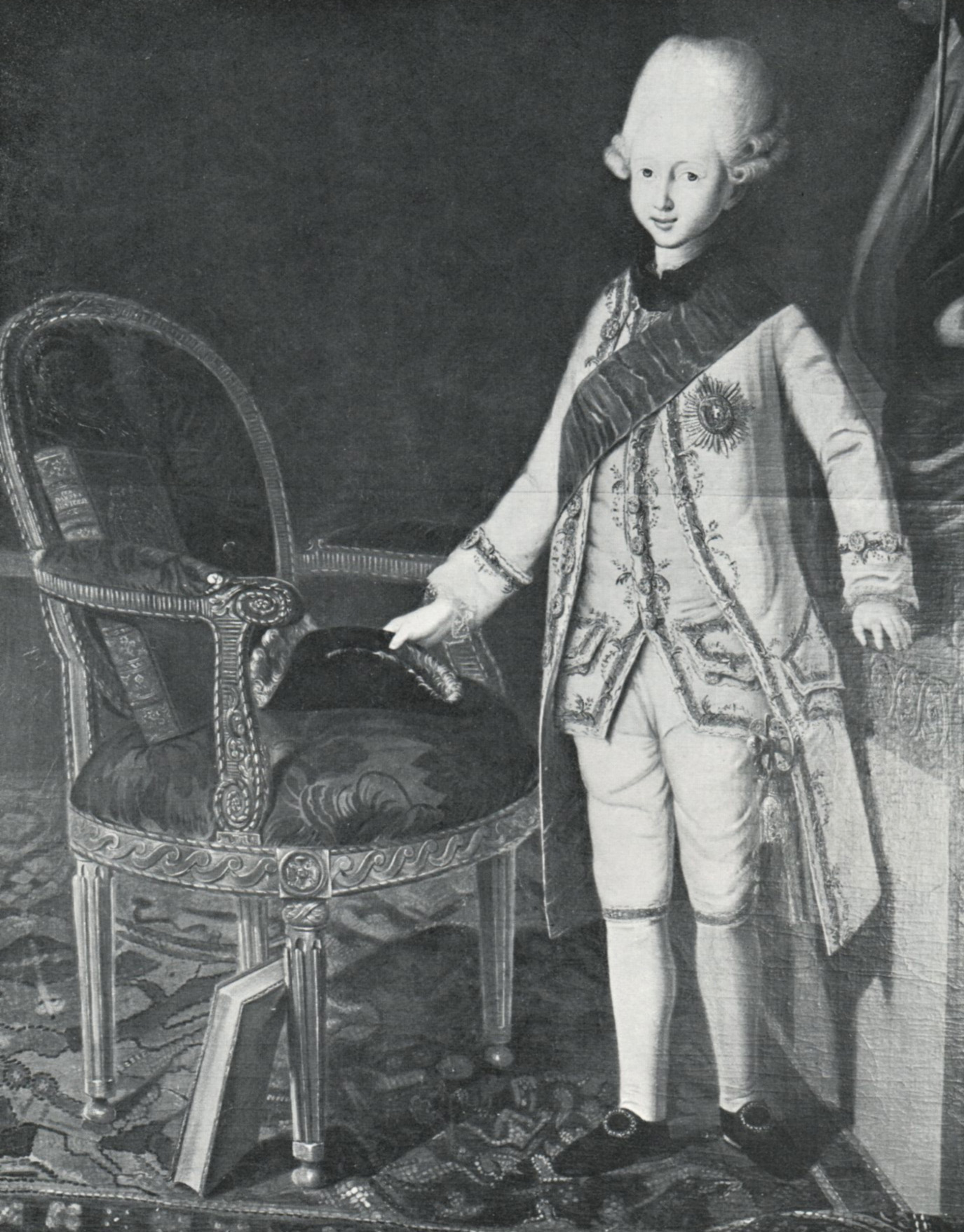 The painting from 1774 is portraying the Danish Crown Prince Frederik VI. next to a comparable armchair.